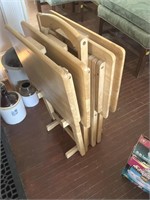 Four wooden TV trays