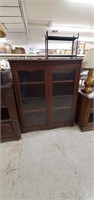 China cabinet with glass doors measuring 37” wide