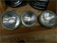 3 vintage T3 headlights. Two with surrounding