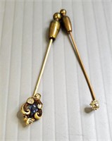 2 tested gold stick pins set with diamonds: