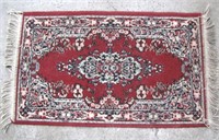 CLARET RED JUTE & OLEFIN AREA RUG APPROX 44" X 24"