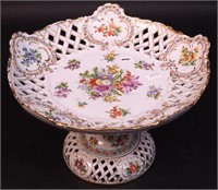 A reticulated compote with hand-painted flowers,