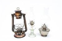 Two Oil Lamps and a Lantern