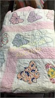 Handmade butterfly quilt shows wear