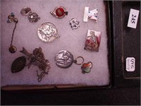 Group of sterling silver pins including