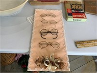 crafted item with antique glasses attached to it
