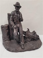 Plaster cowboy statue