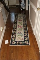 Two Floral Themed Rugs