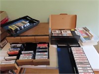 Country music cassette tapes & holders.