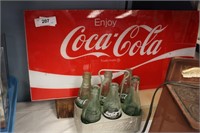 COCA COLA PLASTIC SIGN AND METAL CARRIER BOTTLES