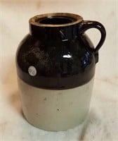 Wax seal crock jug, dark brown over tan