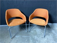 (2) Source modern accent chairs in orange