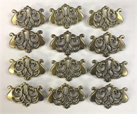 (12) Brass keyhole plates 2 1/2”x 1 3/4”