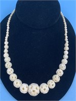 Ivory necklace with 11 Chinese puzzle ball beads,