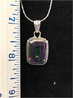 3 1/4" iridescent stone pendant on a sterling silv