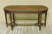 Louis XVI Style Walnut Cane Seated Bench.