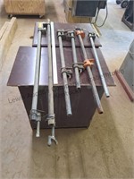 6 adjustable pipe clamps, two are missing handle