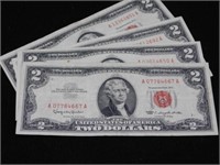 Four $2 bills, all 1963