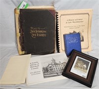 lot of vintage books and picture frame