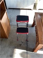 two step red metal step stool