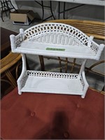 White wicker wall shelf