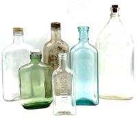 (6) Vintage Embossed Advertising Bottles
