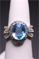 Sterling oval cut blue topaz ring, lab created