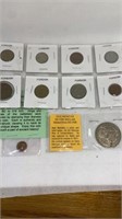 Old Mexican silver dollar and other foreign coins