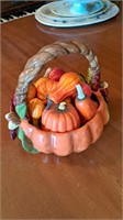 Ceramic fall basket with plastic pumpkins and
