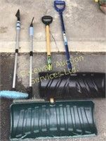 Snow shovels and snow brushes.