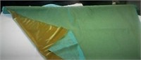 Roll of Green iridescent reversible fabric