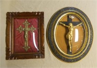 Framed Crucifixes Under Convex Glass.