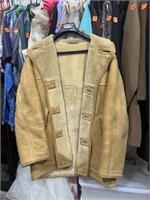 Tan coat with fluffy inside. Size XL