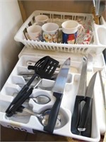 Tray of kitchen utensils including spoons, forks,