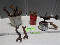 Antique wrenches and a blow torch