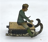 early French man on sled tin litho penny toy