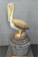Two Piece Concrete Pelican On Log Stand