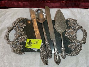 Group of serving untensils including carving knive