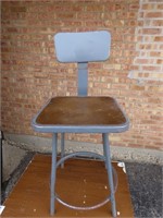 Grey industrial metal stool.