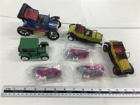 4 tin cars made in Japan and 3 hot wheels blimps