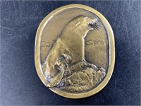 Bronze belt buckle depicting a seal, from Indiana