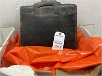 Large Orange Trash Bags and Briefcase