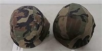 Older and newer Army helmets