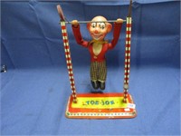 .vintage Toe Joe tin toy