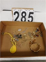 Flat Of Costume Jewelry Includes Yellow Necklace
