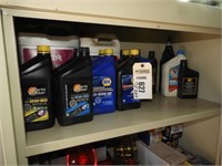 Contents of top shelf, various oil jugs