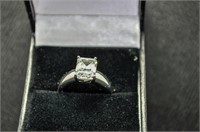 White sapphire emerald cut solitaire ring