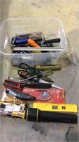 Small tub filled with tools, scissors,