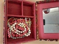 Jewelry in Red Cloth Jewelry Box