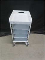 WHITE WOODEN CABINET W/ 4 DRAWERS & ON WHEELS